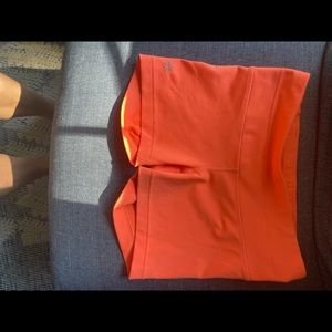 Bright orange Athleta spandex shorts